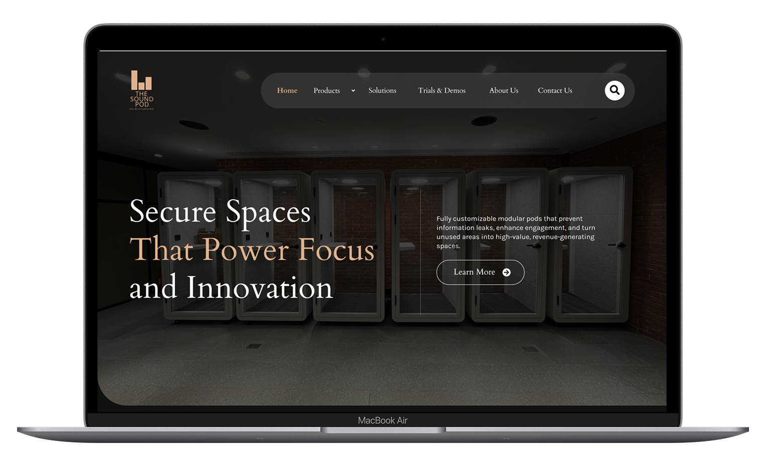 Hero section showing a row of modular pod enclosures in a dim data-room, with large serif text: 'Secure Spaces That Power Focus and Innovation'.